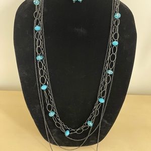 necklace and earrings with light blue bead